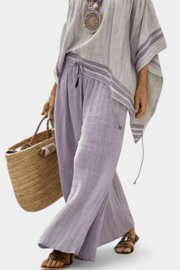 Zandrel | Elegante top con hombros descubiertos y pantalones anchos a rayas