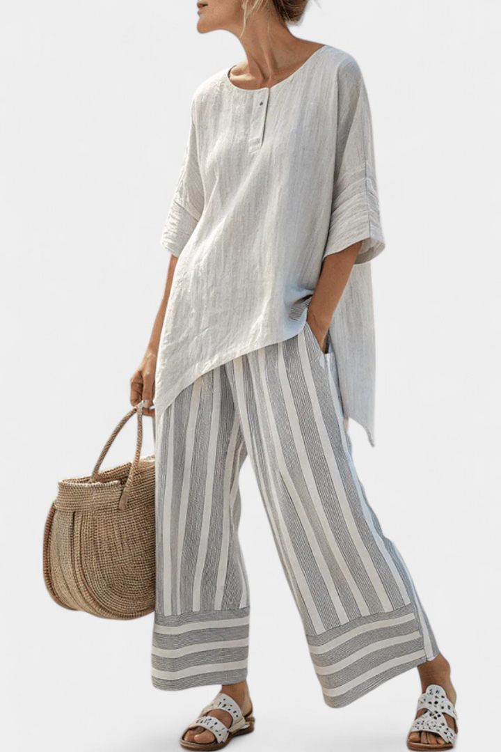 Talvora | Elegante blusa asimétrica y pantalón a rayas