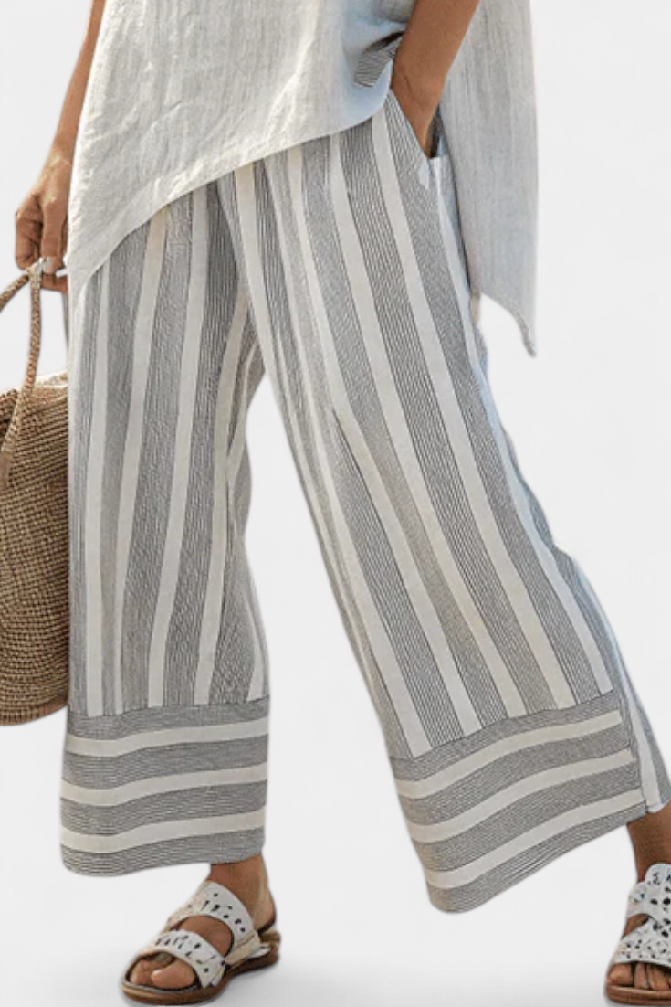 Talvora | Elegante blusa asimétrica y pantalón a rayas